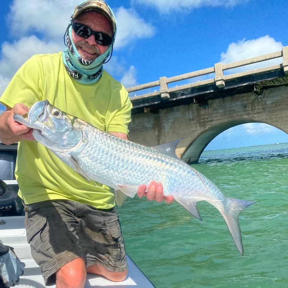 An image of a happy angler on a Tarpon Trip with Hot Water Fishing